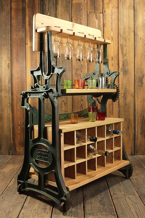 a period cast iron domestic mangle chassis converted into a fine wine station with glass racks bottle storage and a dual work surface