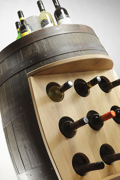an authentic period oak and steel band wine cask remodelled as a wine station with recessed storage for several bottles and a flat top for pouring
