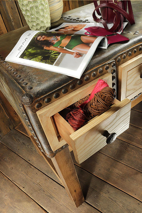 beautiful handmade table with a period industrial cast iron base and a highly figured wood top and recess under