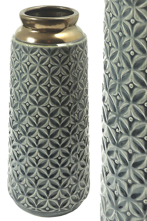 An exotic cylinder vase with a gilded heck and a deep relief circular pattern to the body 