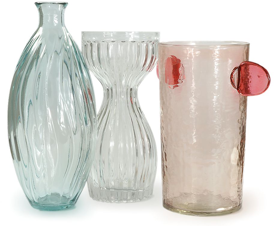 Three exquisite vases, blue, clear and pink with flowing patterns within the glass