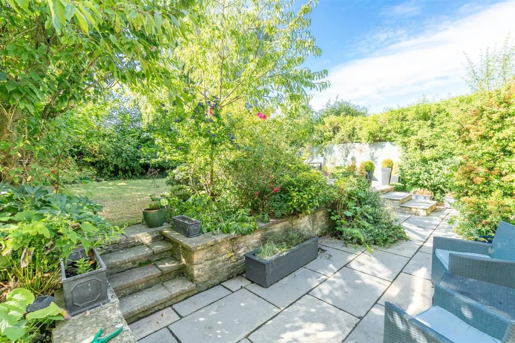 Sawn limestone paving in a cottage garden