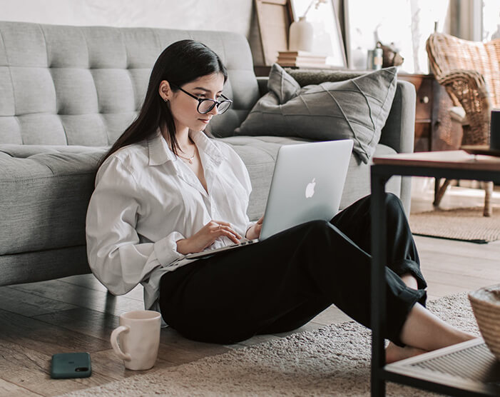 An example Shopify customer at her computer