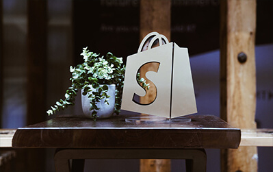 shopify graphic logo on a table