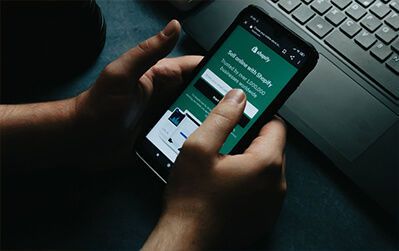 shopify user on their mobile phone