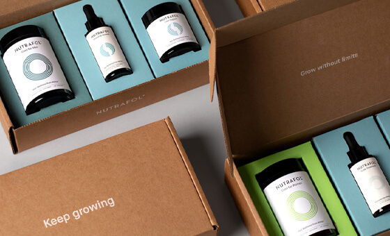 essential oil and wellness products in nicely decorated shipping boxes