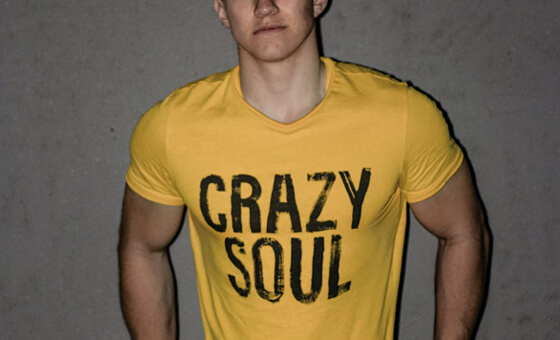 a yellow t shirt worn by a young man with the words crazy soul printed on it