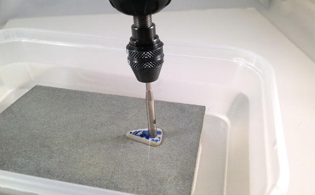 Using your Dremel drill with a diamond drill bit in a water trough to drill holes through glass, stone, shell and ceramic