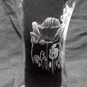 Glass engraving of poppies on a vase by Paul Amphlett.